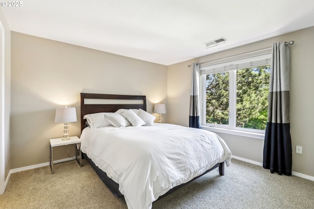carpeted bedroom with baseboards