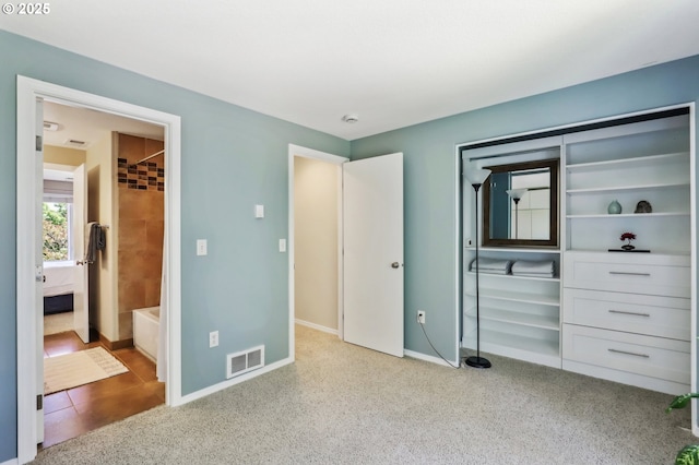 unfurnished bedroom featuring baseboards and carpet flooring