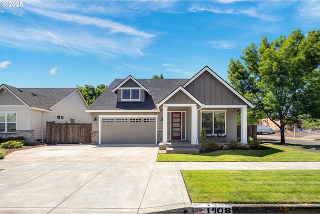 1408 Taylor St, Eugene, OR 97402 - craftsman house with board and batten siding, driveway, stone siding, a garage, and a shingled roof