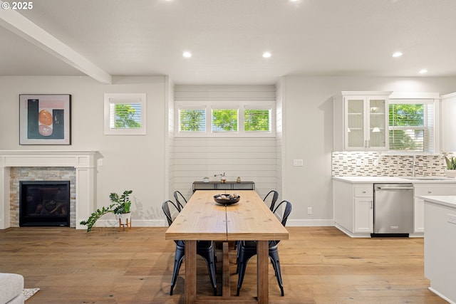1408 Taylor St, Eugene, OR 97402 - dining area with light wood-type flooring, recessed lighting, baseboards, and a stone fireplace