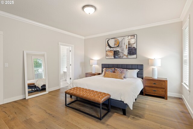 1408 Taylor St, Eugene, OR 97402 - bedroom featuring crown molding, wood finished floors, baseboards, and ensuite bathroom