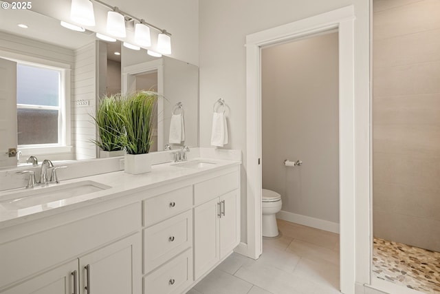 1408 Taylor St, Eugene, OR 97402 - full bathroom with toilet, double vanity, tile patterned flooring, and baseboards