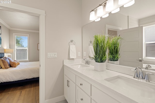 1408 Taylor St, Eugene, OR 97402 - full bath with ornamental molding, double vanity, wood finished floors, baseboards, and connected bathroom