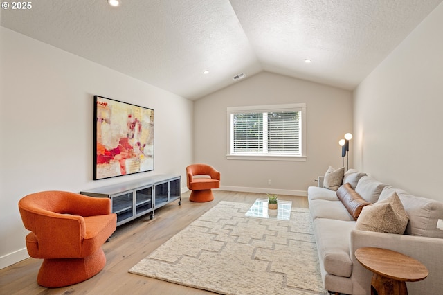 1408 Taylor St, Eugene, OR 97402 - living room with wood finished floors, a textured ceiling, vaulted ceiling, and baseboards