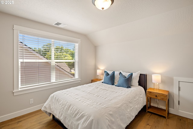 1408 Taylor St, Eugene, OR 97402 - bedroom with lofted ceiling, baseboards, and wood finished floors