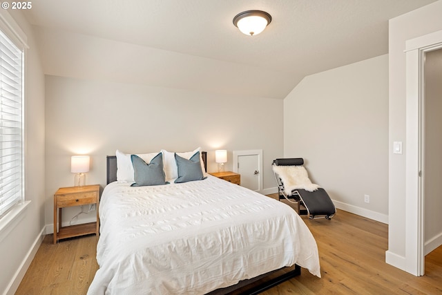 1408 Taylor St, Eugene, OR 97402 - bedroom with vaulted ceiling, baseboards, and light wood-style floors