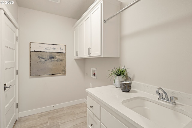1408 Taylor St, Eugene, OR 97402 - laundry room featuring hookup for a washing machine, cabinet space, and baseboards