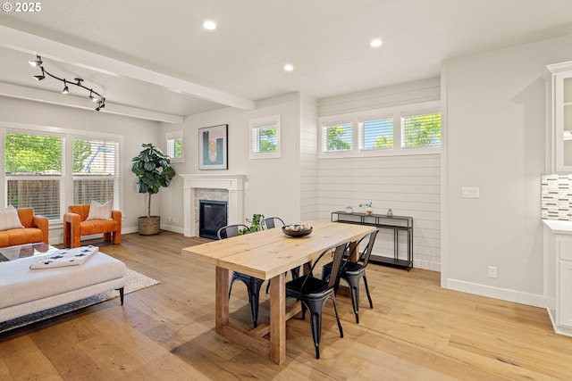 1408 Taylor St, Eugene, OR 97402 - dining room with a glass covered fireplace, baseboards, recessed lighting, light wood-style floors, and beam ceiling