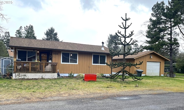 view of front of property with central AC, roof with shingles, and a front yard