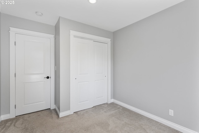 3817 NE 11th Ave, Portland, OR 97212 - unfurnished bedroom featuring light carpet, baseboards, a closet, and recessed lighting