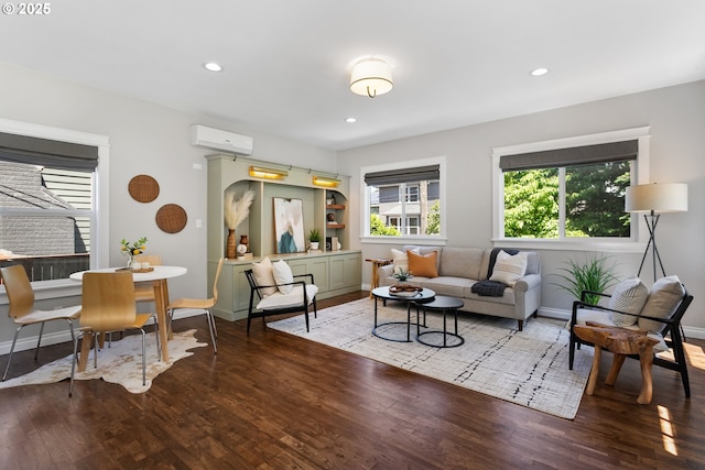 3817 NE 11th Ave, Portland, OR 97212 - living area featuring a wall unit AC, wood finished floors, baseboards, and recessed lighting