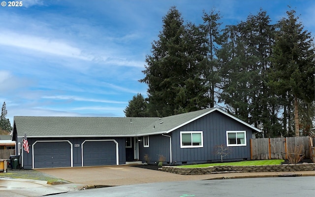 single story home with a garage, concrete driveway, fence, and crawl space