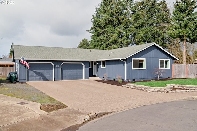 single story home with a garage, a shingled roof, fence, concrete driveway, and crawl space