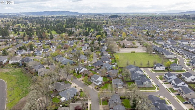 drone / aerial view with a residential view and a mountain view