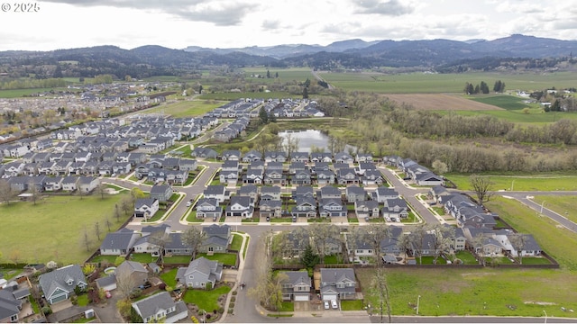 bird's eye view with a residential view and a mountain view