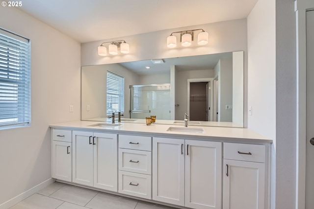 12935 SW Tabor Ter, Beaverton, OR 97007 - full bath with a shower stall, double vanity, tile patterned flooring, and a walk in closet