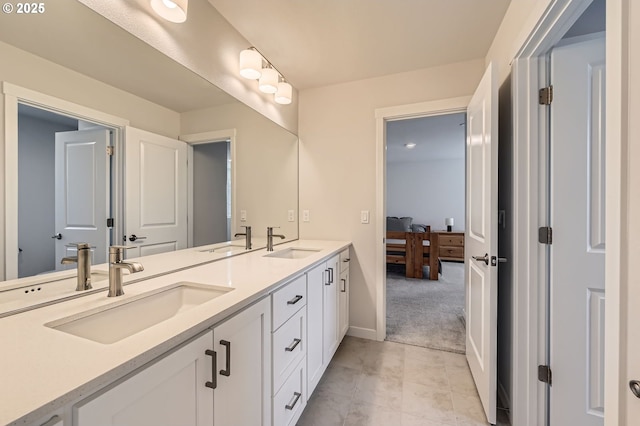 12935 SW Tabor Ter, Beaverton, OR 97007 - ensuite bathroom with double vanity and tile patterned flooring