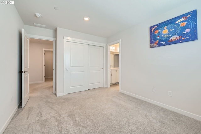 12935 SW Tabor Ter, Beaverton, OR 97007 - unfurnished bedroom with light colored carpet, a closet, and recessed lighting