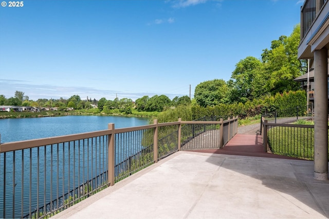 view of patio featuring a water view