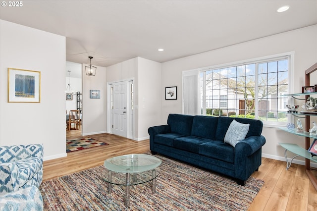 living room with light hardwood / wood-style flooring