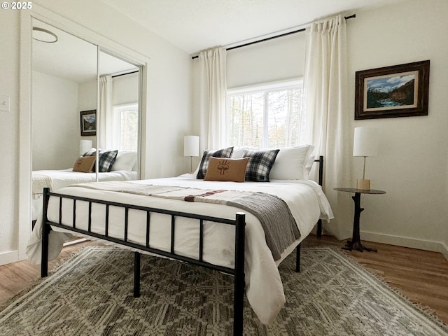 23610 E Gumjuwac Rd, Brightwood, OR 97011 - bedroom with multiple windows, wood finished floors, and baseboards
