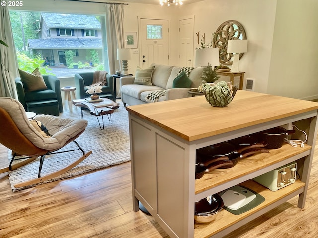 23610 E Gumjuwac Rd, Brightwood, OR 97011 - kitchen featuring butcher block counters, open floor plan, light wood-style flooring, and a kitchen island