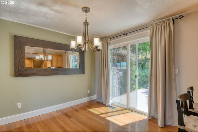 458 NW 21st St, Pendleton, OR 97801 - unfurnished dining area featuring a chandelier and wood-type flooring