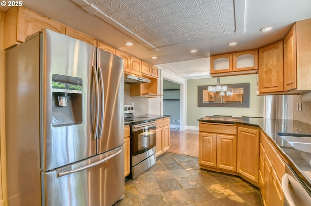458 NW 21st St, Pendleton, OR 97801 - kitchen with appliances with stainless steel finishes, under cabinet range hood, an ornate ceiling, backsplash, and recessed lighting