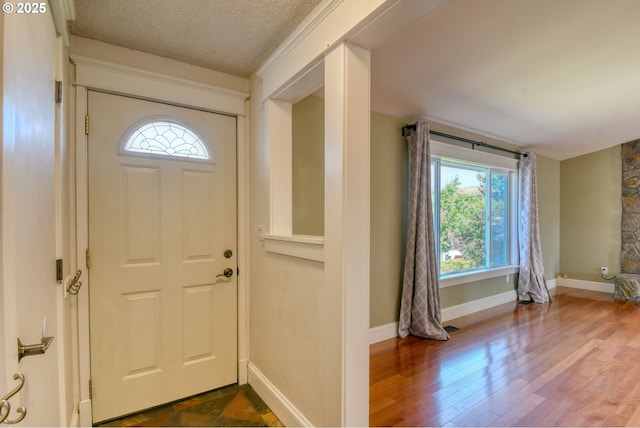 458 NW 21st St, Pendleton, OR 97801 - entryway featuring plenty of natural light, dark wood-type flooring, and a textured ceiling