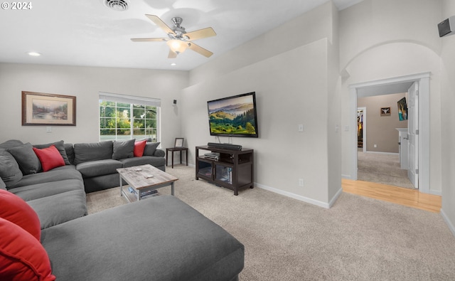 living area featuring baseboards, visible vents, lofted ceiling, carpet flooring, and recessed lighting