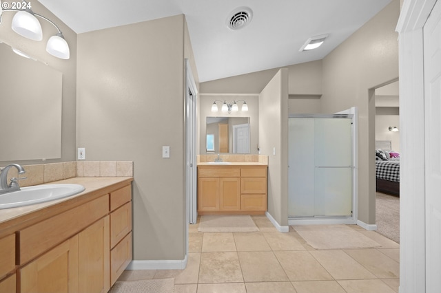 full bath with tile patterned flooring, a sink, visible vents, and a shower stall