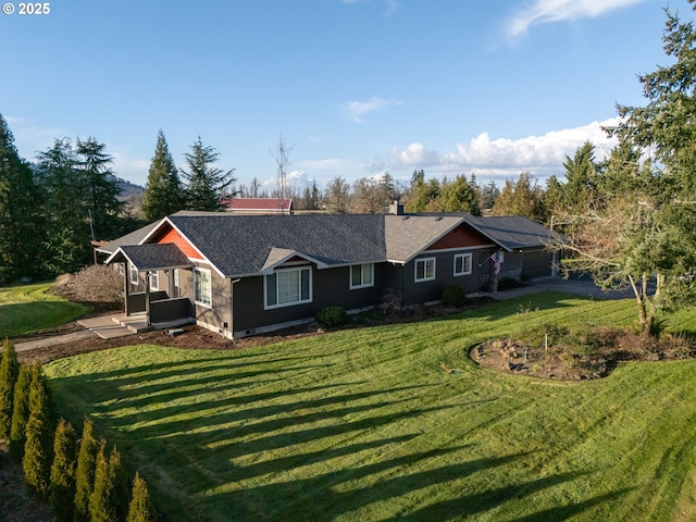 view of front of home with a chimney and a front lawn