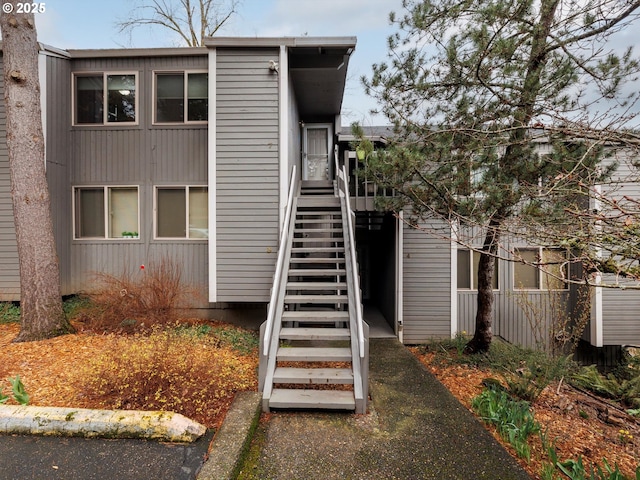 view of side of property with stairs