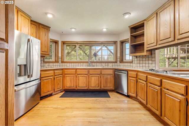21075 NE Turner Ln, Hillsboro, OR 97123 - kitchen featuring stainless steel appliances, open shelves, light wood-type flooring, healthy amount of natural light, and recessed lighting