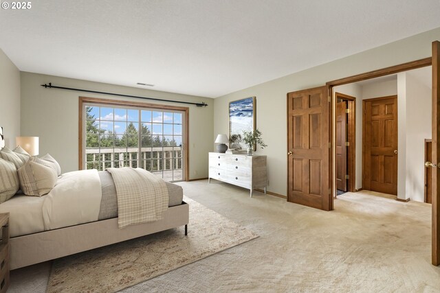 21075 NE Turner Ln, Hillsboro, OR 97123 - bedroom with access to outside and light colored carpet