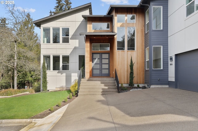 exterior space featuring a garage and concrete driveway