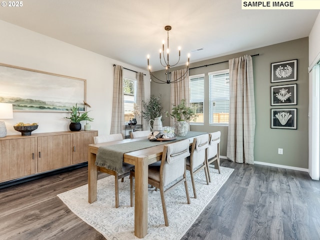 dining room featuring visible vents, a notable chandelier, dark wood finished floors, and baseboards