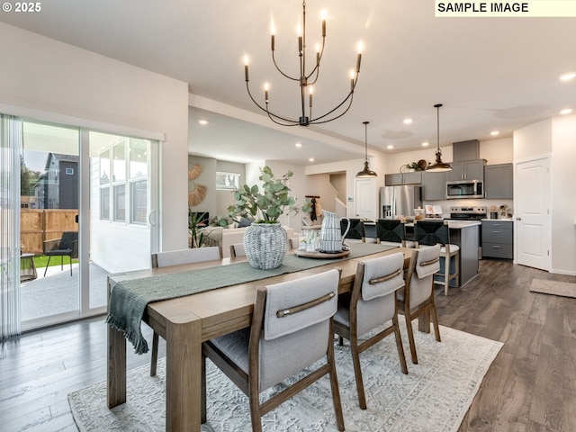 dining area with a chandelier, recessed lighting, and dark wood-style flooring