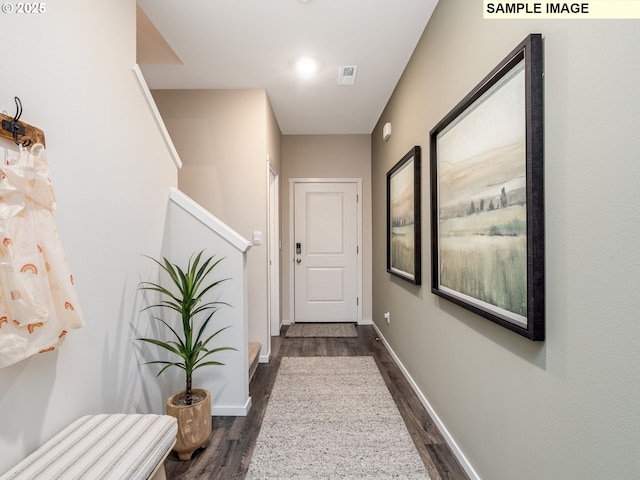 hallway featuring dark hardwood / wood-style flooring