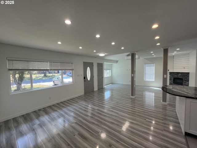 3345 SW 124th Ave, Beaverton, OR 97005 - unfurnished living room with a fireplace, recessed lighting, and dark wood-style flooring