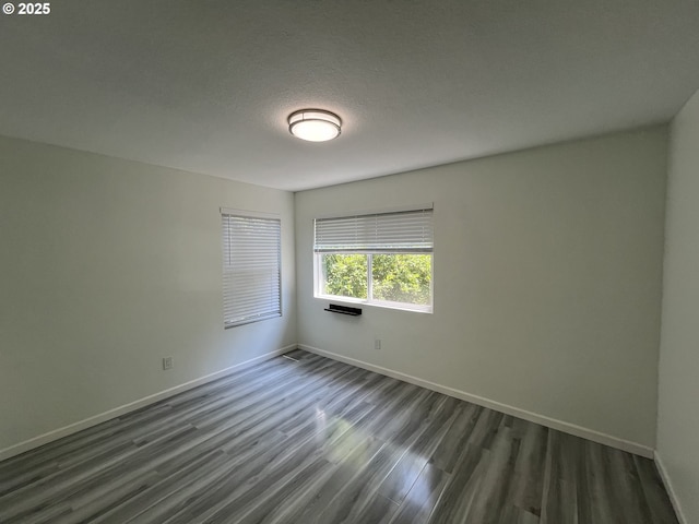 3345 SW 124th Ave, Beaverton, OR 97005 - empty room with dark wood finished floors and baseboards