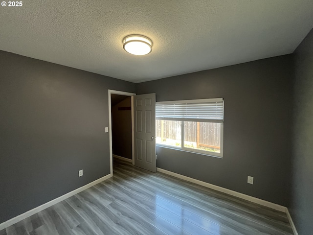3345 SW 124th Ave, Beaverton, OR 97005 - unfurnished room with wood finished floors and a textured ceiling
