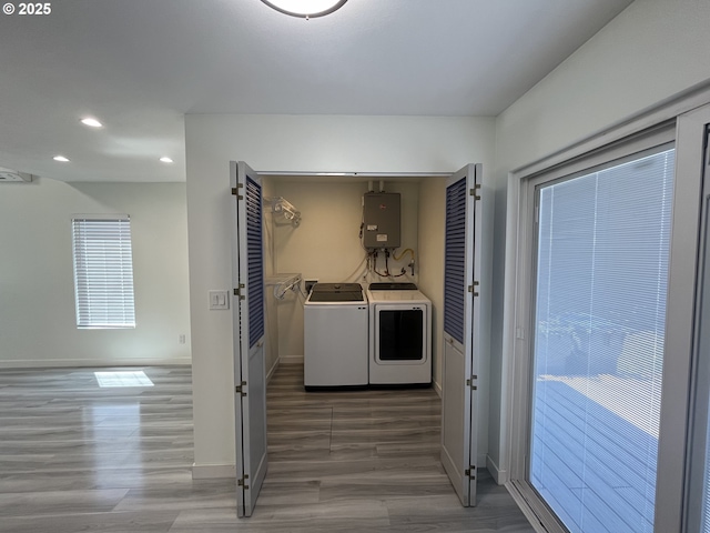 3345 SW 124th Ave, Beaverton, OR 97005 - washroom featuring washer and dryer, water heater, wood finished floors, and recessed lighting