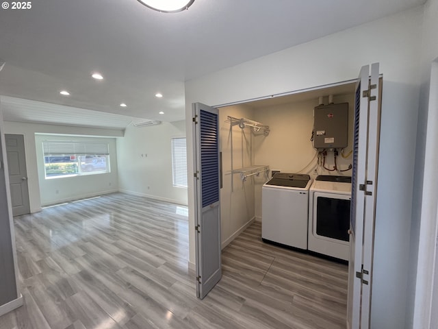 3345 SW 124th Ave, Beaverton, OR 97005 - laundry room featuring independent washer and dryer, recessed lighting, light wood-type flooring, and water heater