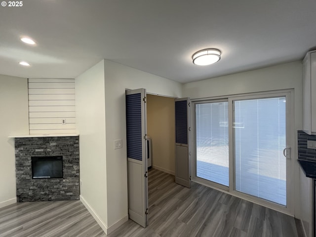 3345 SW 124th Ave, Beaverton, OR 97005 - unfurnished living room with wood finished floors, a fireplace, and recessed lighting