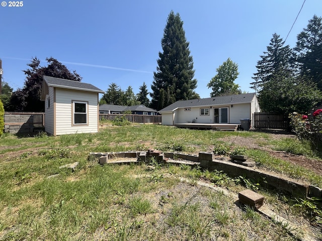 3345 SW 124th Ave, Beaverton, OR 97005 - fenced backyard with a wooden deck and a storage shed