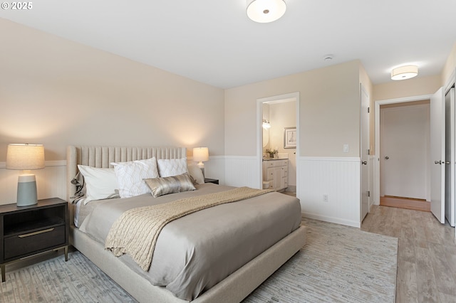 3025 SW Wallula Ave, Gresham, OR 97080 - bedroom with wainscoting, light wood-type flooring, and ensuite bathroom
