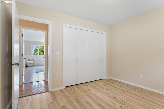 3025 SW Wallula Ave, Gresham, OR 97080 - unfurnished bedroom featuring light wood-style flooring and a closet