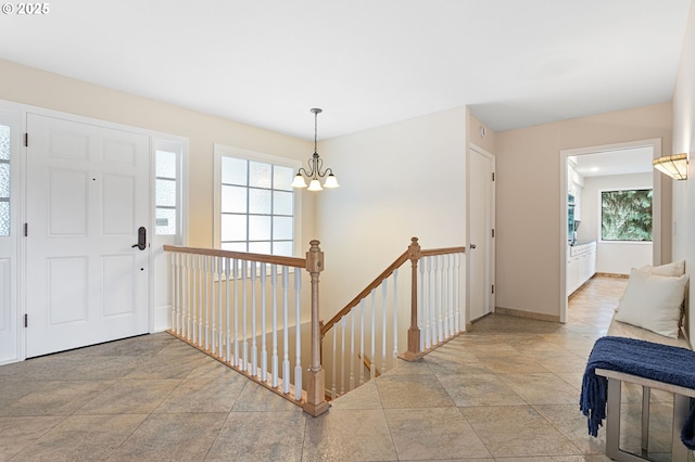 3025 SW Wallula Ave, Gresham, OR 97080 - foyer entrance featuring a chandelier, plenty of natural light, and light stone finish flooring