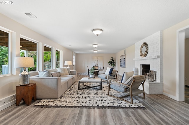 3025 SW Wallula Ave, Gresham, OR 97080 - living area featuring wood finished floors and a fireplace